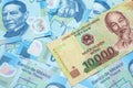 A Vietnamese dong bank note with Mexican twenty peso bank notes Royalty Free Stock Photo