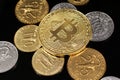 A close up image of West African Franc coins and a golden bitcoin on a black background Royalty Free Stock Photo
