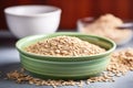 close-up image of whole grain cereal in a ceramic bowl