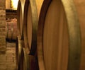 Close up image of wine barrels in a wine cellar