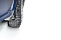 Close-up Image of Winter Car Tire on Snowy Road with Space for Your Text. Drive Safe Concept