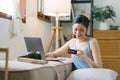 Close-up image of a woman making an online purchase on a computer using a mockup credit card. Selective focus Royalty Free Stock Photo