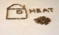 Close up image of wood pellet fuel grain kernels forming shape of house and letters