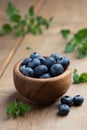 Close-up image of a wooden bowl filled with fresh blueberries Royalty Free Stock Photo