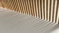 Close up image of a wooden comb resting on a white surface with dramatic shadows cast by natural light. Royalty Free Stock Photo
