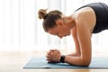 Close up image of yoga woman holding elbow plank pose on the mat Royalty Free Stock Photo