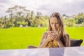 Close-up image of young hipster girl sitting at cozy home interior and using modern smartphone device, female hands Royalty Free Stock Photo