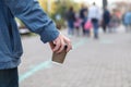 Close-up image of young hipster man walking at night city street Royalty Free Stock Photo