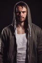 Close up image of young street man with hood on his head. glitter in eyes Royalty Free Stock Photo