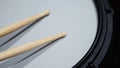 Close-up images of drumsticks on electronic drum snare pad