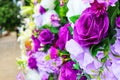 Close-up images focus on some purple flowers in the bouquet.