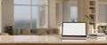 Notebook laptop mockup on marble tabletop over blurred background of minimal cozy living room Royalty Free Stock Photo