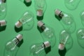 Close-up of an incandescent lamp on green background.