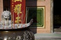 Close up incense burner with incense sticks pray and show respect to god as chinese style with temple background. Traditional chin Royalty Free Stock Photo