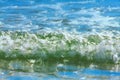 Close up of incoming whitewater wave breaking onto the shore Royalty Free Stock Photo