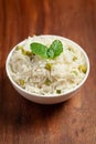 Close-up of Indian Basmati steamed Rice or matar Pea pulao or Pulav garnished with fresh green mint leaf Royalty Free Stock Photo