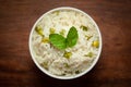 Close-up of Indian Basmati steamed Rice or matar Pea pulao or Pulav garnished with fresh green mint leaf in a ceramic white bowl Royalty Free Stock Photo