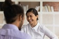 Close up Indian businesswoman laughing, chatting with colleague during break Royalty Free Stock Photo