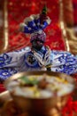 Close-up of indian home temple during the birthday celebration of Lord Krishna Janmashtami with puja thali and kheer khir