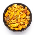 Close-Up of Indian spicy snacks Namkeen - All in one in a black Ceramic bowl, made with fried peanut, corn flakes, sweet pea Royalty Free Stock Photo