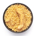 Close-Up of Indian spicy snacks Namkeen - Bikaneri Besan Bhujia in a black Ceramic bowl, made with chickpea flour Besan,