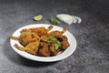 Close-up Indian street food tea time snacks Chilli Pakora served in a White ceramic plate Royalty Free Stock Photo