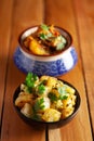 Close-up of Indian vegetarian classic combination of dishes Jeera Aloo Potatoes in cumin Flavored and spicy Potato and Tomato