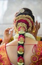 Indian bride getting ready and doing hair make up and jewelry