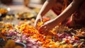 Close up of Indian woman making marigold flower garland at home