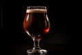 close-up of individual glass of draught beer with foamy head and rich color