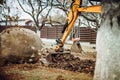 Close up of industrial bulldozer scoop moving earth and doing landscaping works Royalty Free Stock Photo