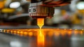 Close-up of an industrial 3D printer depositing glowing molten material onto a surface, creating a high-tech