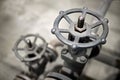 Close-up of industrial pair of valves with focus on foreground ventil with copy space Royalty Free Stock Photo