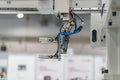 Close-up of an industrial robot, possibly in a factory or workshop The image features a large metal structure with multiple cables Royalty Free Stock Photo