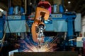 Close-up industrial robot is welding in a car factory Royalty Free Stock Photo