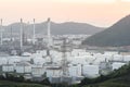 Close up Industrial view at oil refinery plant form industry zone with sunrise and cloudy sky Royalty Free Stock Photo