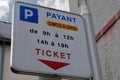 French sign showing paid parking tickets