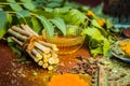 Close up of ingredients of ayurvedic treatment i.e neem,neem leaves,neem powder,bark,clove,turmeric,water. Royalty Free Stock Photo