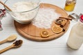 Close-up of ingredients for preparing dough and gingerbread cookies, cutting molds, bottle with plant based milk, glass jar with Royalty Free Stock Photo