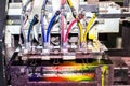 Close-up of inkjet printers in large machines.Colorful background