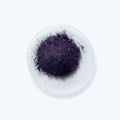 Close up inorganic chemical on white laboratory table. Potassium permanganate KMnO4, a common chemical compound that combines