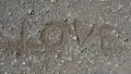 Close up of inscription love on pebble beach, free copyspace Royalty Free Stock Photo