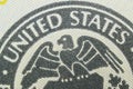 close-up - the inscription United States and the eagle on the banknote of one hundred US dollars. Royalty Free Stock Photo