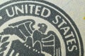 close-up - the inscription United States and the eagle on the banknote of one hundred US dollars. Royalty Free Stock Photo