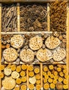 Close-up of insect hotel made from straw, bark, sticks, wood