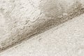 Close up of an inside corner with lime-cement plaster mix. Monochromatic image. Construction industry background texture Royalty Free Stock Photo