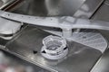 Close up of the inside of a modern dish washer Royalty Free Stock Photo