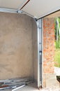 Close up on Install Garage Door Metal Profil Post Rail and Spring Installation Royalty Free Stock Photo