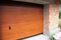 Close up on installing garage door boards in new brick house construction. Royalty Free Stock Photo