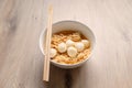 Close up Instant noodle with meatballs on wooden background. Royalty Free Stock Photo